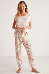 Pyjama à haut rose uni et pantalon fleuri