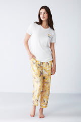 Pyjama femme à haut blanc et pantalon à imprimé floral NC