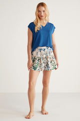 Ensemble short jupe imprimé tropical et t-shirt bleu uni